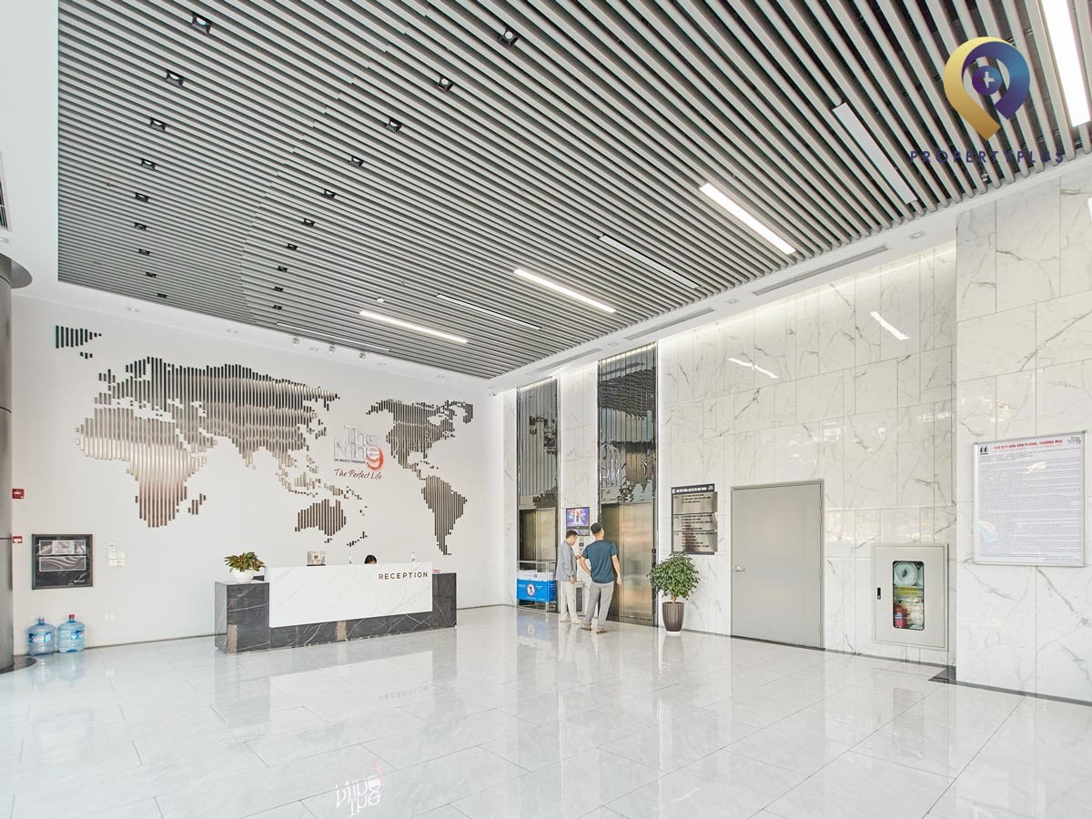 The Nine office building lobby on the first floor with modern design and reception desk - hình ảnh từ Property Plus